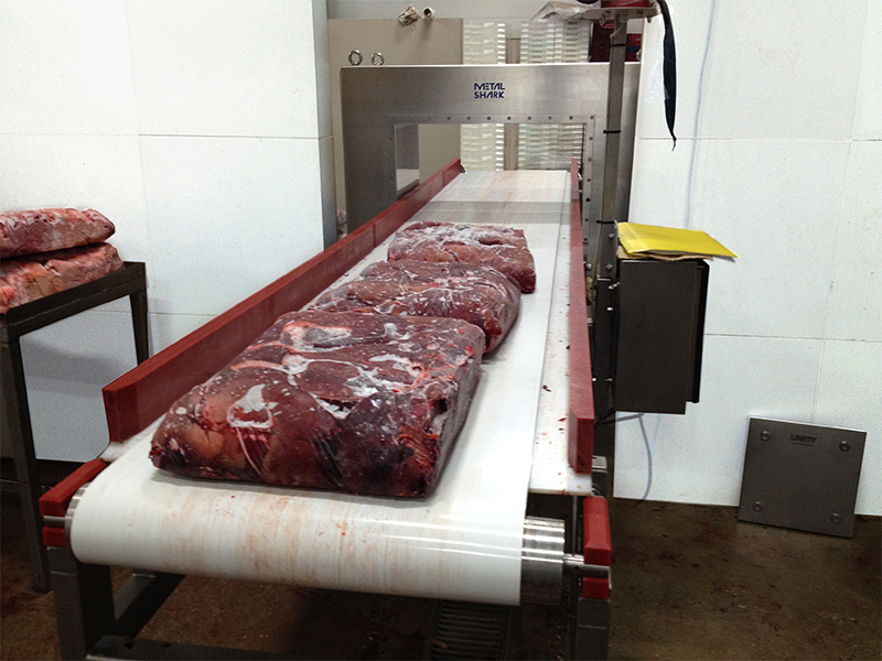 Meat on a conveyor in a factory